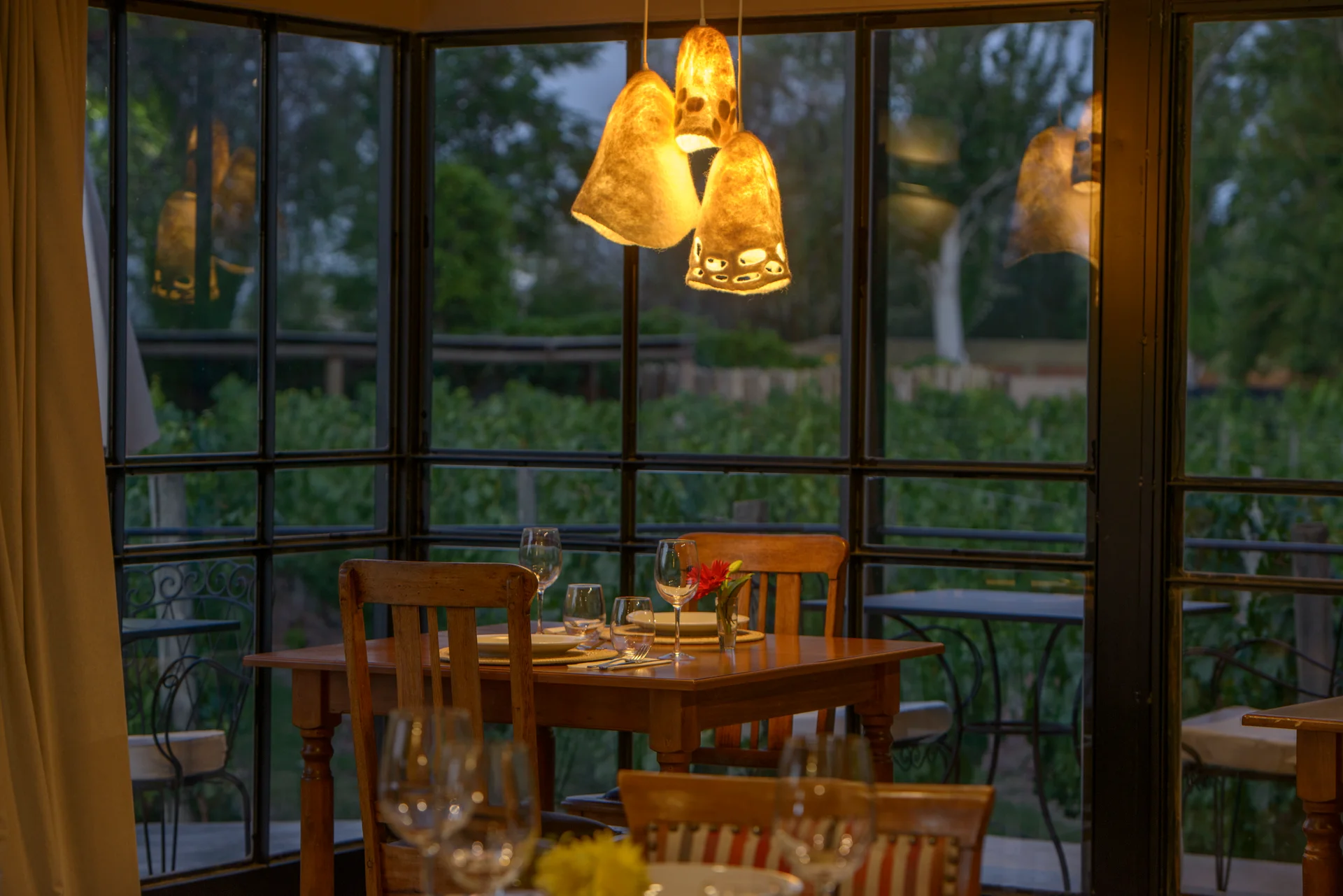 Fine dining restaurant table setup at Verde Oliva with wine region views